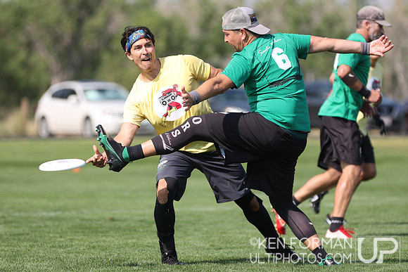 Idris Nolan (Eldors #6) defends against Tom Brown (GrandMaster Flash #11) during Pool Play at the 2021 USAU Masters National Championships