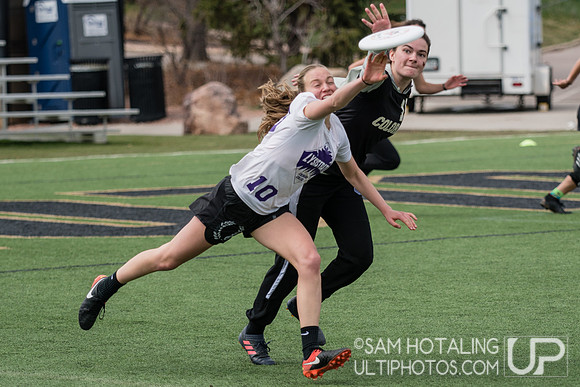 Bailey Shigley gets a block on an under at Rocky Mountain DI Conf. Championships, Women's