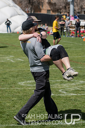 Coach Jon Stirk carries Graham Buhse off the field at Rocky Mountain DI Conf. Championships, Men's