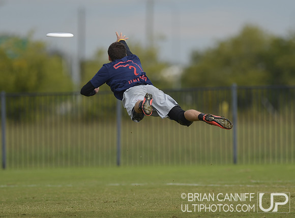 FRISCO, TX: Jeremy Langdon (#2 Florida United (Jacksonville, FL) lays out high trying to retain possesion in the game against Johnny Bravo (Denver, CO) in bracket play at the USA Ultimate Men's Nation