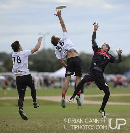 FRISCO, TX: Defenders Nick Spiva (Chain Lightning #36) and Dylan Tunnell (Chain Lightning #78) block a pass to David Cranston (Truck Stop #5) in bracket play at the USA Ultimate Men's National Champio